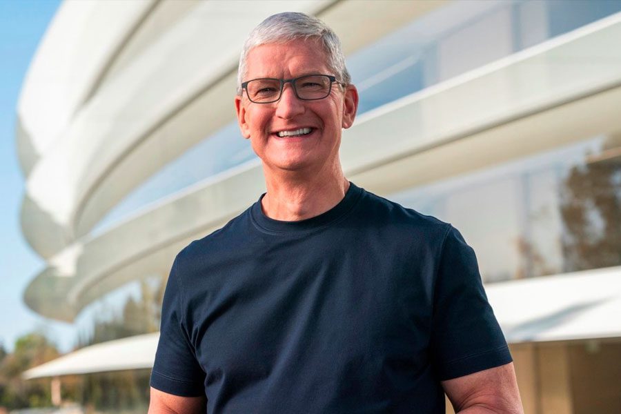 Photograph of Tim Cook, with the Apple HQ in the background